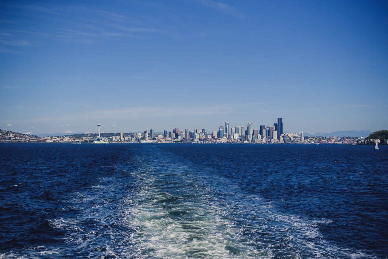 services-02 View of Seattle skyline across Puget Sound from a ferry on a sunny day.